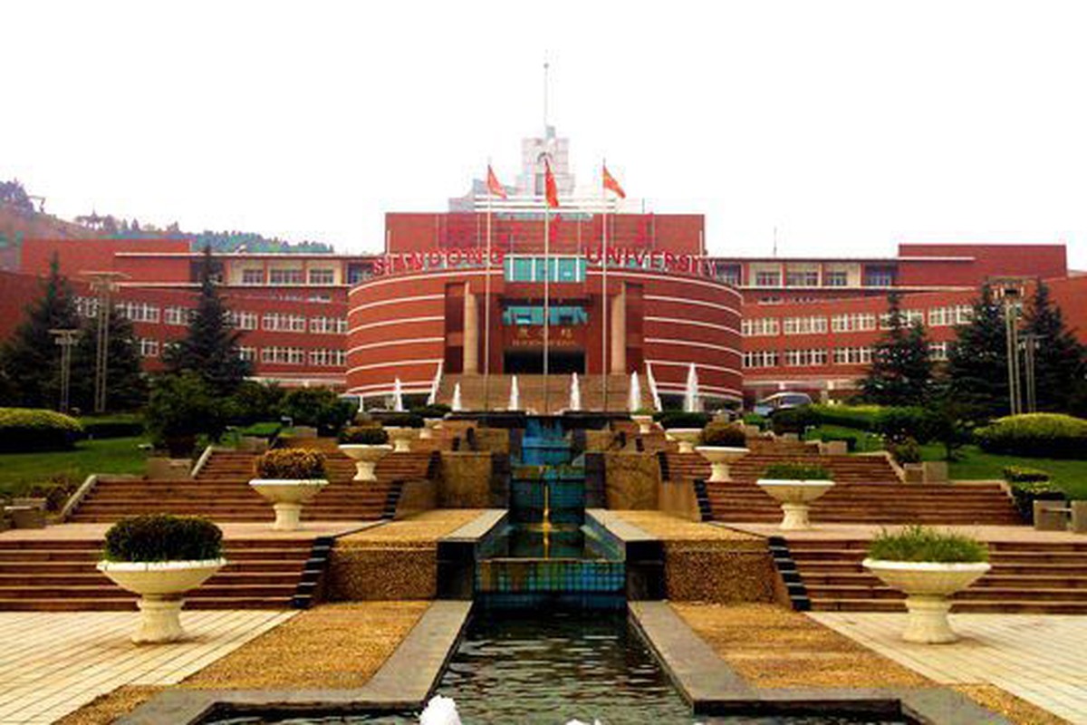 A broad courtyard framed by substantial campus buildings.